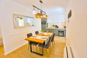 a kitchen and dining room with a table and chairs at Luxury Urban Villa Apartments With Jacuzzi in Split