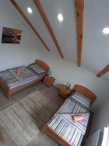 Postel nebo postele na pokoji v ubytování Bedrooms Cerovac