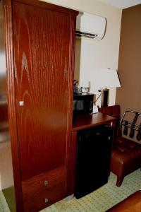 a room with a wooden floor and wooden cabinets at Coast Lethbridge Hotel & Conference Centre in Lethbridge