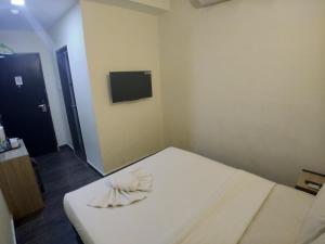 Postel nebo postele na pokoji v ubytování Hotel Westree KL Sentral