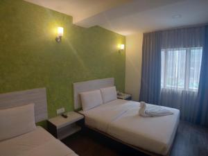 Postel nebo postele na pokoji v ubytování Hotel Westree KL Sentral + 37 fotografií