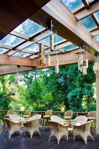 a group of tables and chairs on a patio at Hotel Gergana - Ultra All Inclusive in Albena