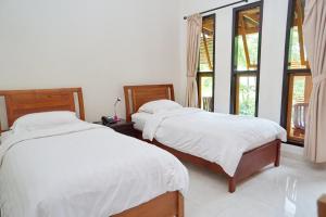 Cama o camas de una habitación en Spring Hill Hotel Ruteng