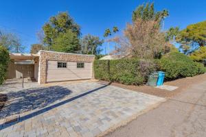 a house with a garage and a driveway at Best Little Guesthouse in Melrose! New Listing! in Phoenix