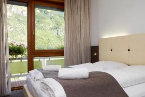 Postel nebo postele na pokoji v ubytování Hotel Raffl + 37 fotografií