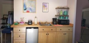 a kitchen with a sink and a counter with a dishwasher at Best Little Guesthouse in Melrose! New Listing! in Phoenix