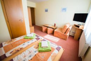 Postel nebo postele na pokoji v ubytování Penzion Ajda