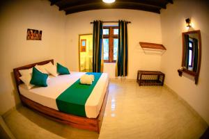 Postel nebo postele na pokoji v ubytování Kandy Spice Villa