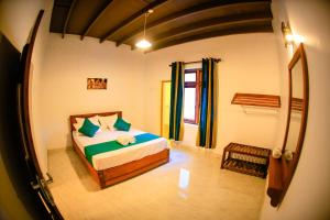 Postel nebo postele na pokoji v ubytování Kandy Spice Villa