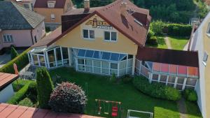 an aerial view of a house with a yard at Penzion Ajda in Liptovský Mikuláš