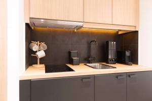 a kitchen with a sink and a counter top at Downtown Syntagma apartment 2 in Athens
