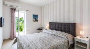 Posteľ alebo postele v izbe v ubytovaní Rooms & Apartments Bruno