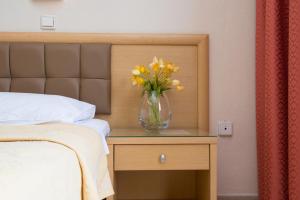 Кровать или кровати в номере Hotel Villa Natassa