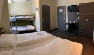 Voodi või voodid majutusasutuse Behringers City Hotel Nürnberg toas