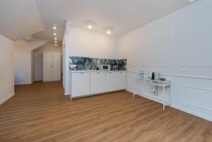 Kuchyňa alebo kuchynka v ubytovaní Apartamenty Czwarte Piętro