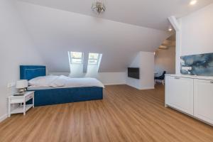 Posteľ alebo postele v izbe v ubytovaní Apartamenty Czwarte Piętro