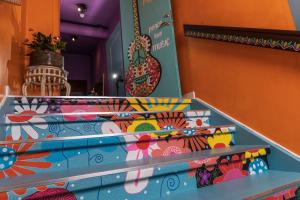 a set of stairs in a room with colorful tiles at FlipFlop Beach Rooms in Falkenberg