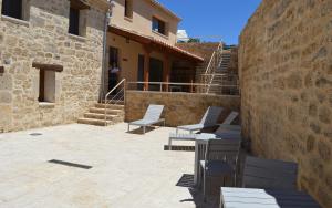 a group of chairs and tables on a patio at Santa Brigida - Real 1 in Hontanas