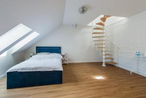 Posteľ alebo postele v izbe v ubytovaní Apartamenty Czwarte Piętro