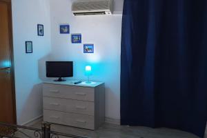 TV a/nebo společenská místnost v ubytování Casa vacanze Porta Garibaldi