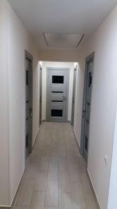 an empty room with a hallway with a door at 105 in Khmelnytskyi