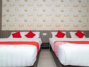 Ένα ή περισσότερα κρεβάτια σε δωμάτιο στο MK Paradise hotel