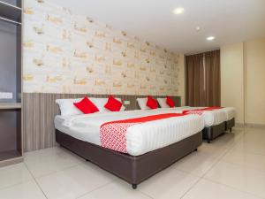 Ένα ή περισσότερα κρεβάτια σε δωμάτιο στο MK Paradise hotel