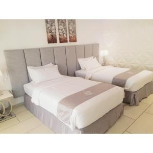 two beds in a hotel room next to each other at Marina Point Bay Resort in Panglao +107 photos