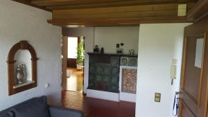 a living room with a couch and a fireplace at Apartments Almstein in Abtenau