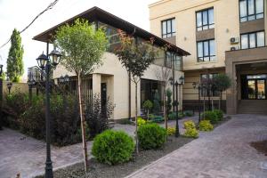 a building with a street light in front of it at Oasis Residence in Bishkek