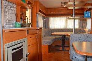 A kitchen or kitchenette at Camping Du Parc