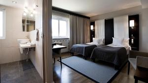 Ένα ή περισσότερα κρεβάτια σε δωμάτιο στο Hotel Tylösand