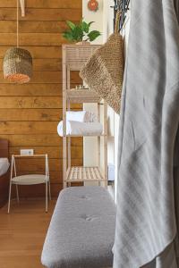 a room with a bunk bed and a chair at The Monkee Studios in Sveti Vlas