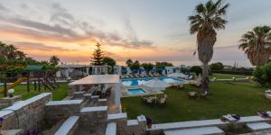 an aerial view of a resort with a swimming pool at Fragoulis Village in Parasporos