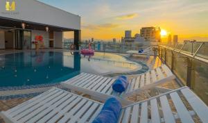 a swimming pool on the top of a cruise ship at Merry Land Hotel Da Nang in Danang