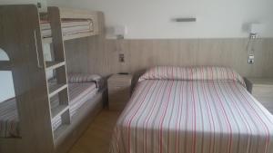 
Llit o llits en una habitació de Hotel Can Català
