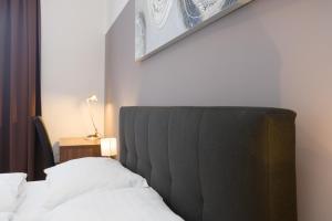 Łóżko lub łóżka w pokoju w obiekcie Vienna Stay Apartments Pezzl 1170