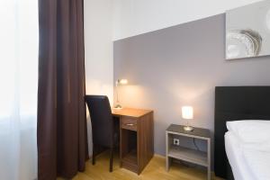 Łóżko lub łóżka w pokoju w obiekcie Vienna Stay Apartments Pezzl 1170