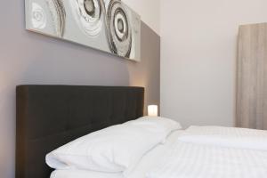 Łóżko lub łóżka w pokoju w obiekcie Vienna Stay Apartments Pezzl 1170