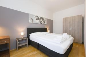 Łóżko lub łóżka w pokoju w obiekcie Vienna Stay Apartments Pezzl 1170