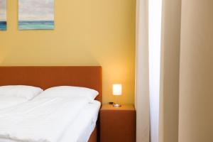 Łóżko lub łóżka w pokoju w obiekcie Vienna Stay Apartments Pezzl 1170