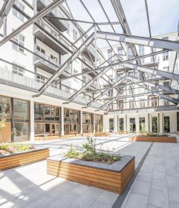 an image of a building with a glass ceiling at Nena Apartments Metropolpark Berlin - Mitte -Adult Only in Berlin
