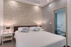 Ένα ή περισσότερα κρεβάτια σε δωμάτιο στο Apartman Marelux