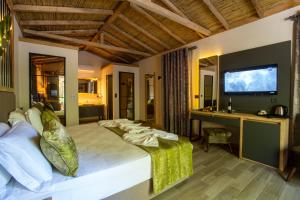 Ένα ή περισσότερα κρεβάτια σε δωμάτιο στο Suna Village Hotel & Bungalow Fethiye