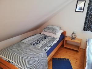 Postel nebo postele na pokoji v ubytování Liliomfa apartman