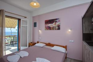 Postel nebo postele na pokoji v ubytování Αlexandros apartment