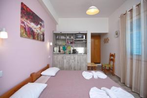 Postel nebo postele na pokoji v ubytování Αlexandros apartment