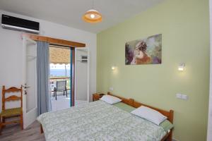 Postel nebo postele na pokoji v ubytování Αlexandros apartment