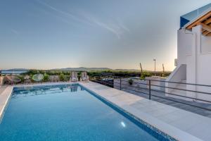 a swimming pool on the roof of a building at Villa Croatica II in Šibenik