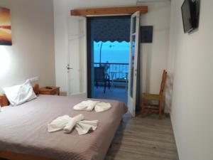 Postel nebo postele na pokoji v ubytování Αlexandros apartment